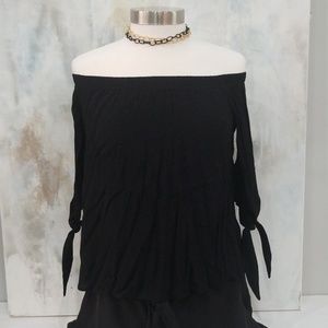 Black off the shoulder blouse with knotted sleeves